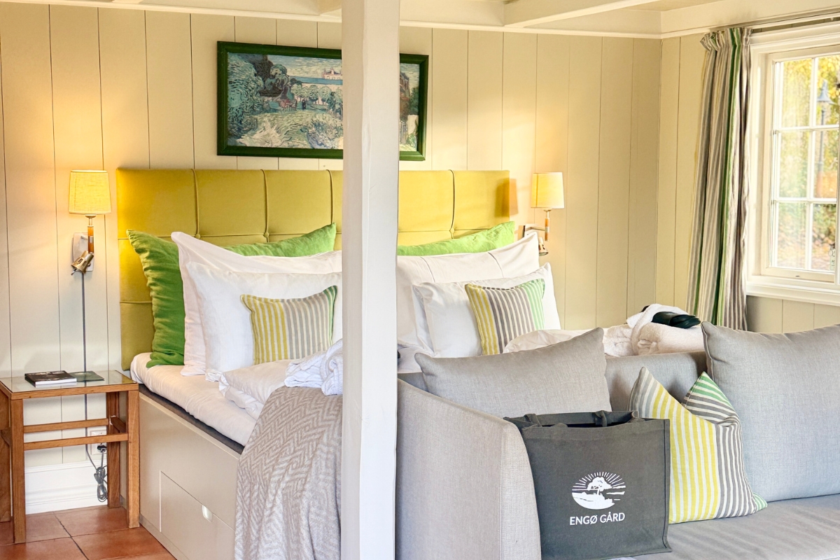 a bed with pillows and a couch