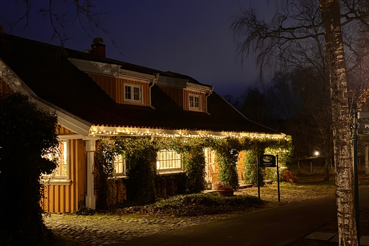 a house with lights on the side