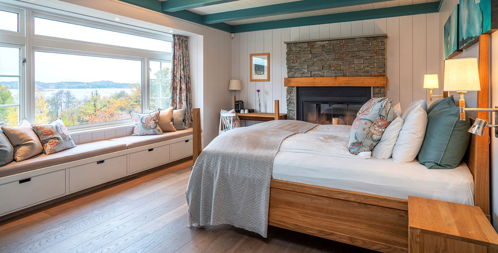 a bedroom with a fireplace and a bed