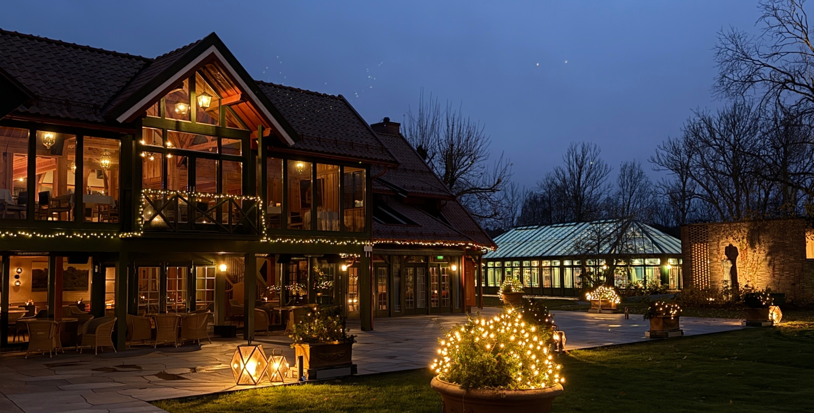 a house with lights in the yard