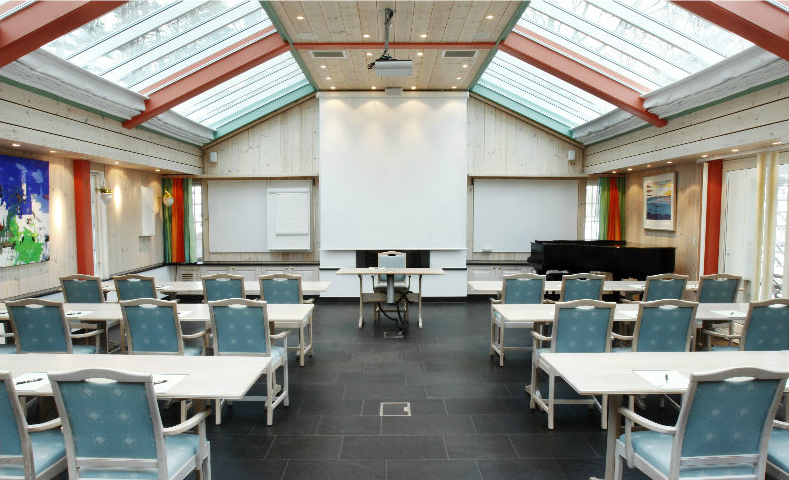 a room with tables and chairs