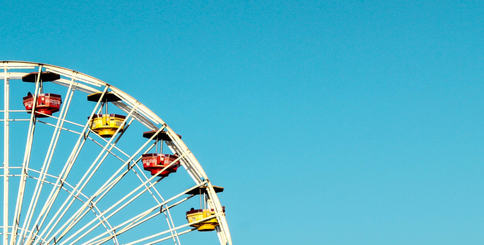 a ferris wheel with blue sky