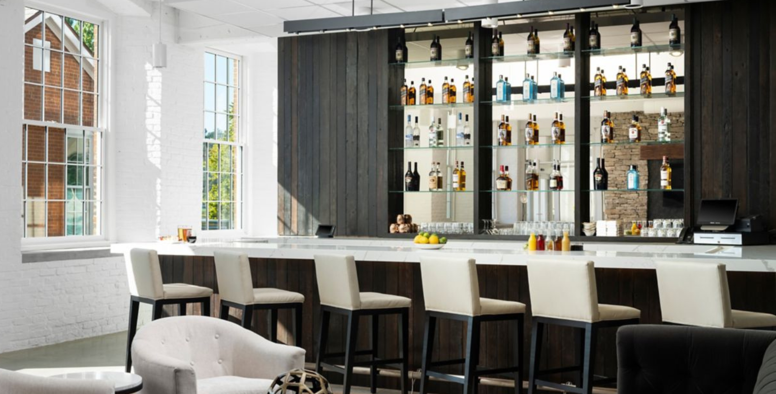 a bar with shelves of liquor