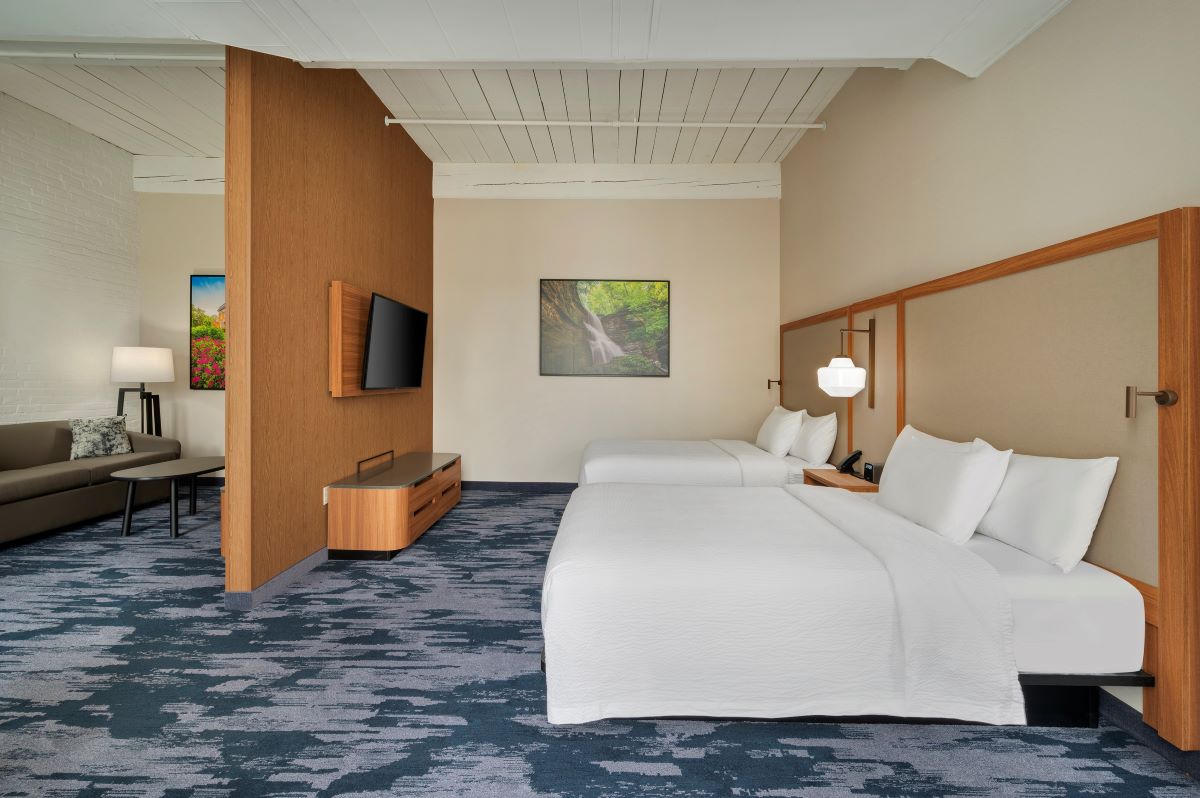a hotel room with two beds