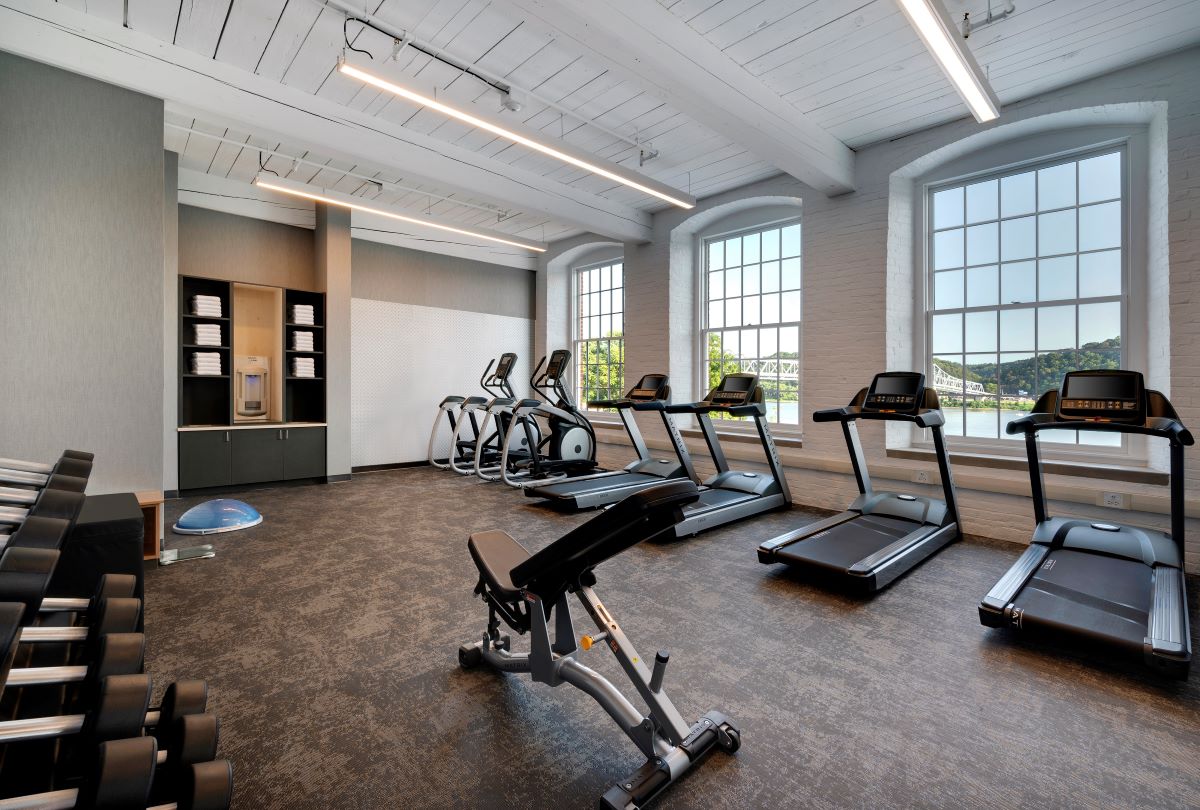 a room with treadmills and exercise equipment