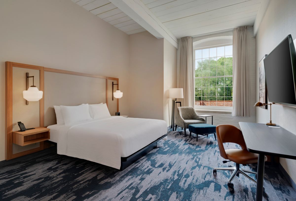 a room with a bed and a desk