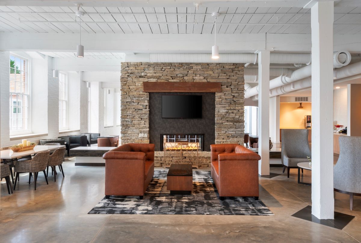 a room with a fireplace and couches