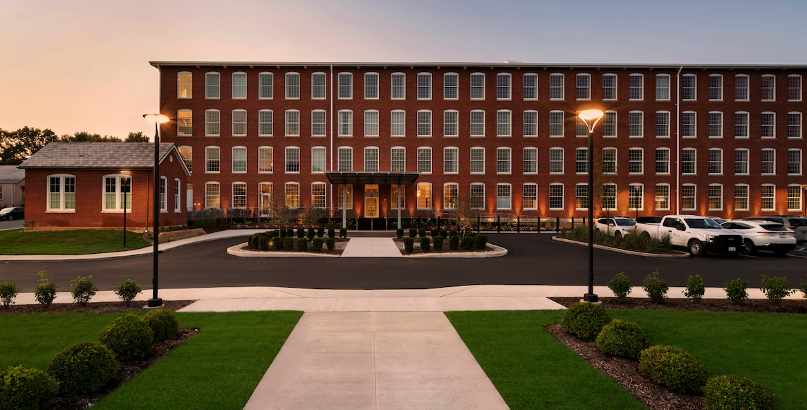 a building with a driveway and a walkway