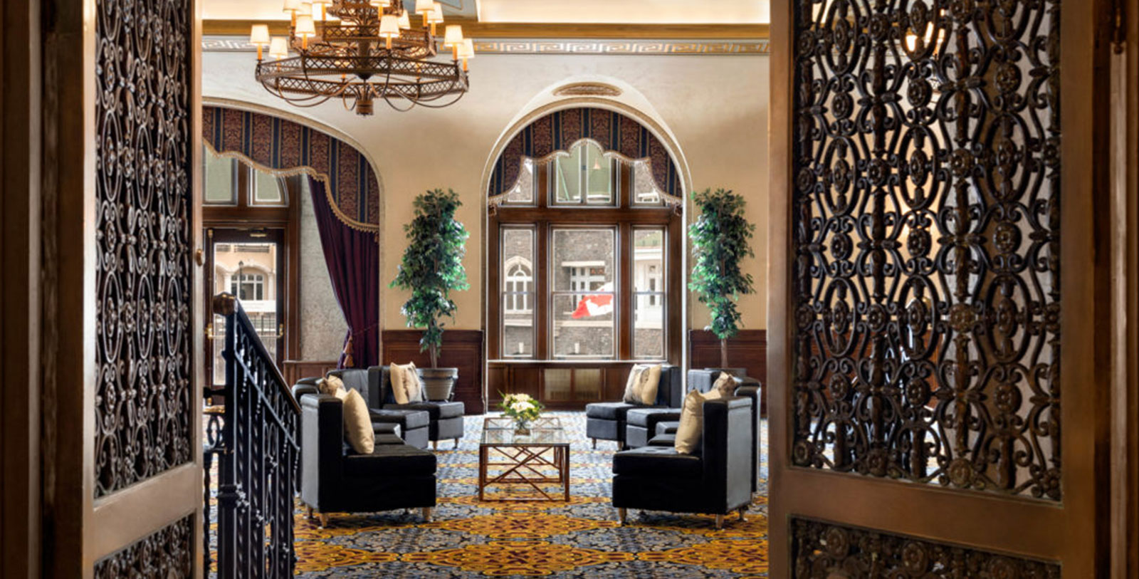 a room with chairs and a chandelier