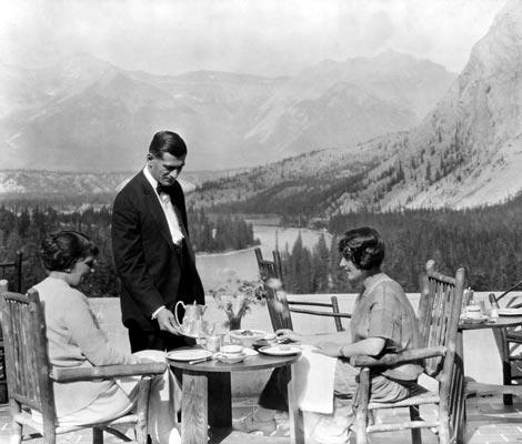 a man serving food to a group of people