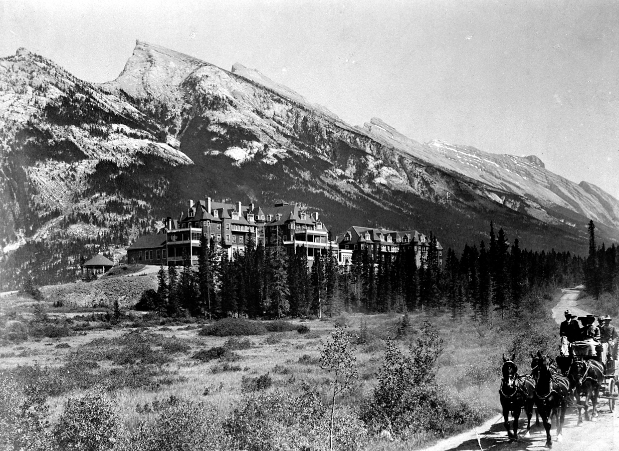 a horse riding in front of a mountain