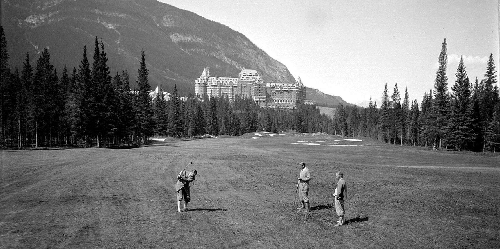 a group of men playing golf