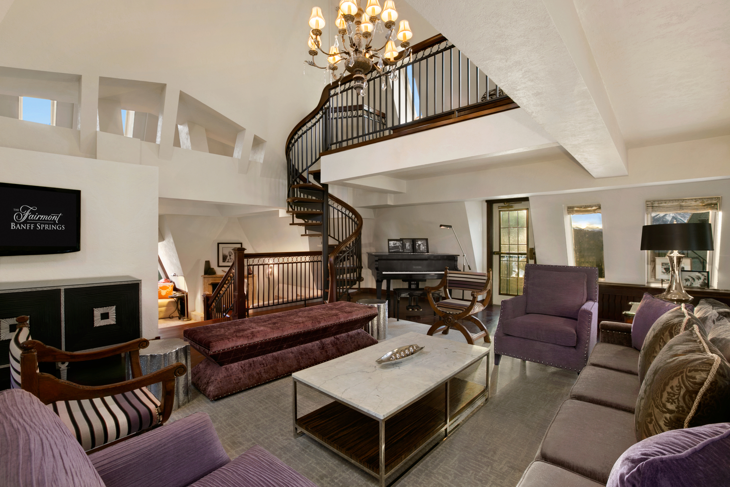 a room with a spiral staircase and a couch