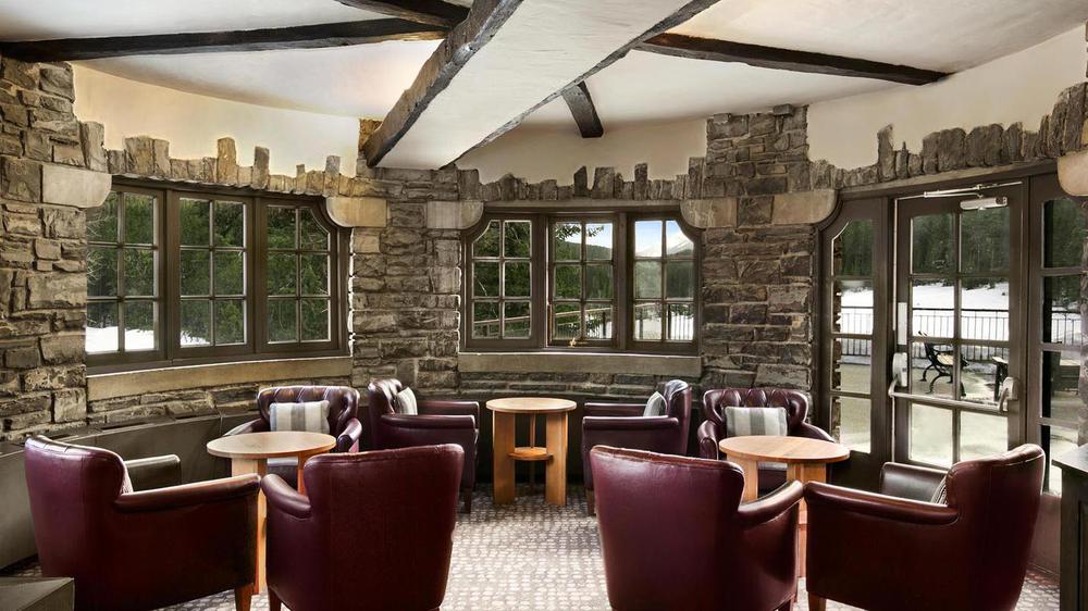 a room with chairs and tables