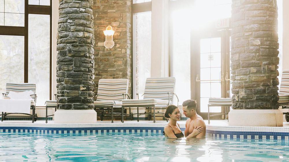 a man and woman in a pool