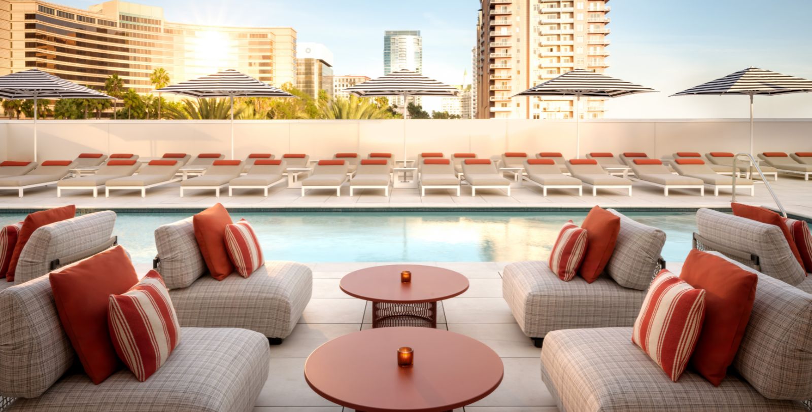 a pool with chairs and tables