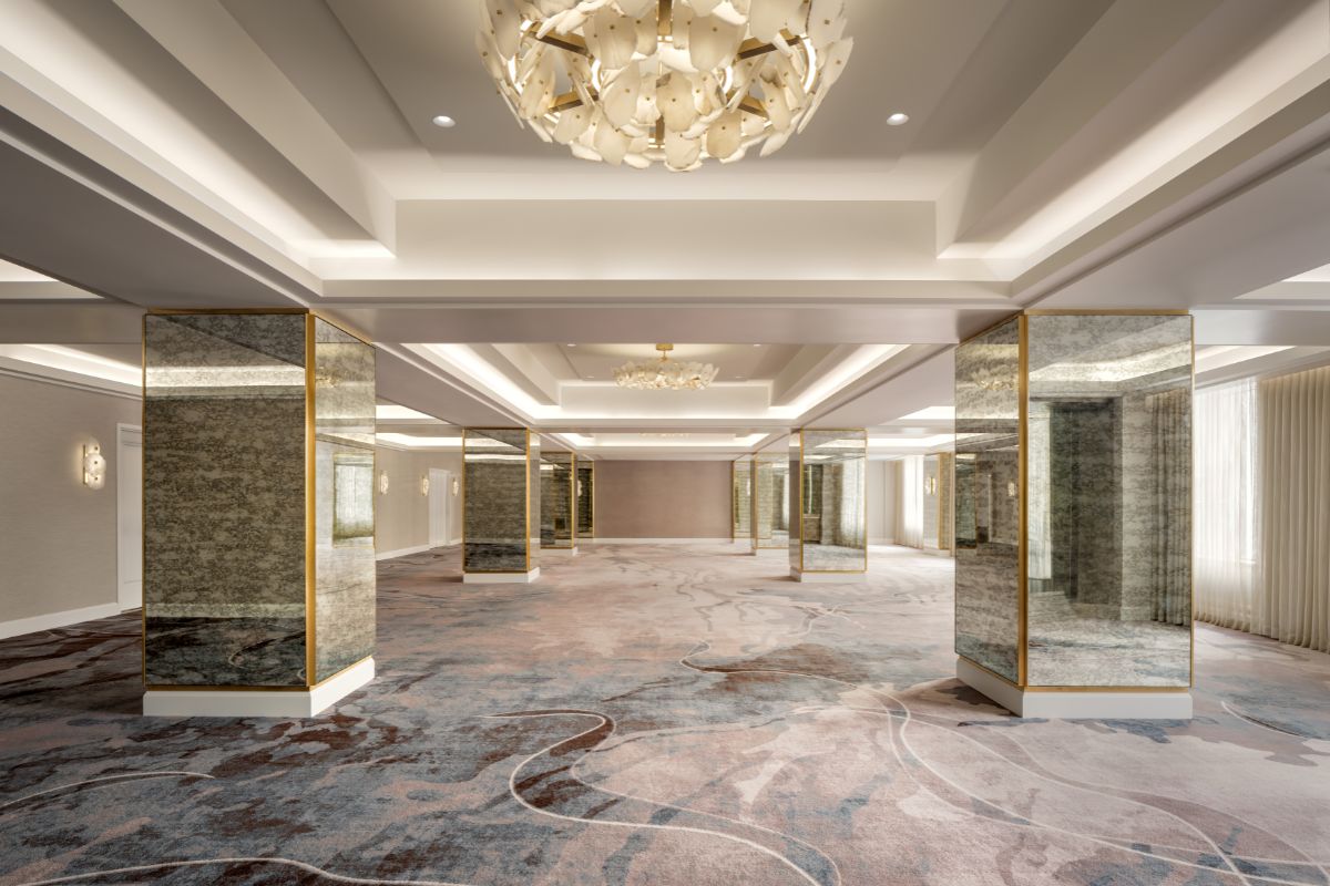 a room with mirrors and a chandelier