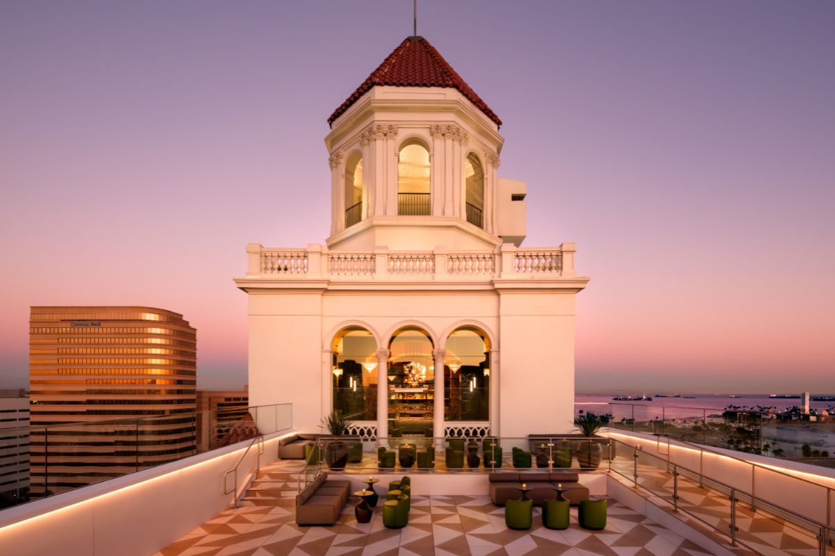 a building with a rooftop and a view of the city