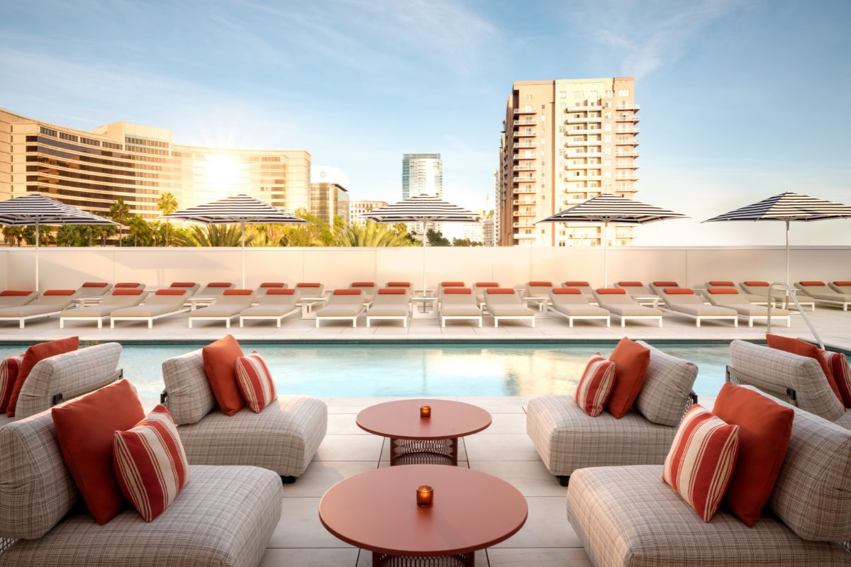 a pool with chairs and tables