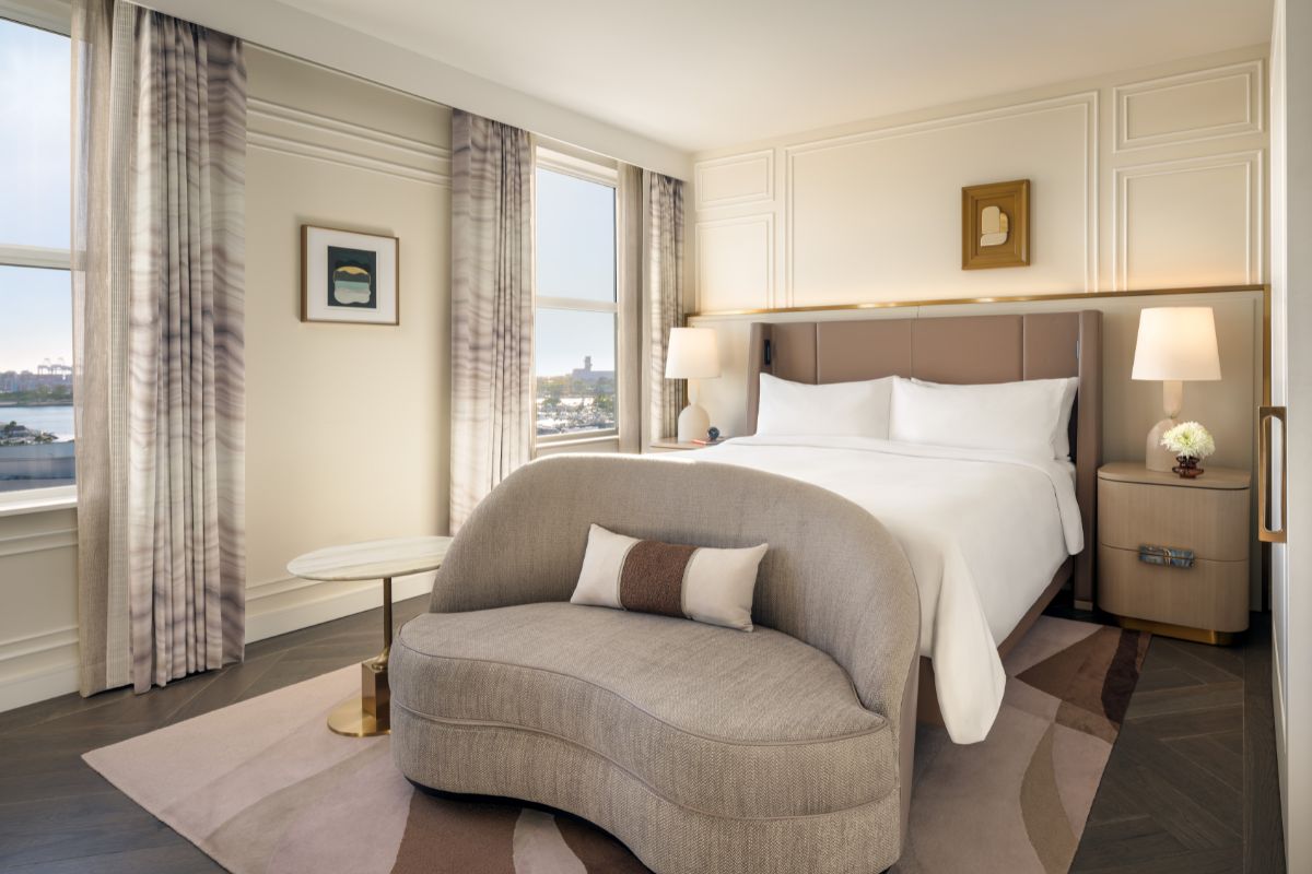a bed with a couch in a room