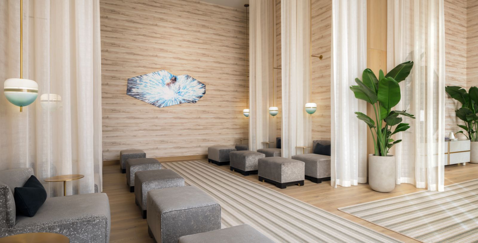 a room with a large group of gray benches and a plant