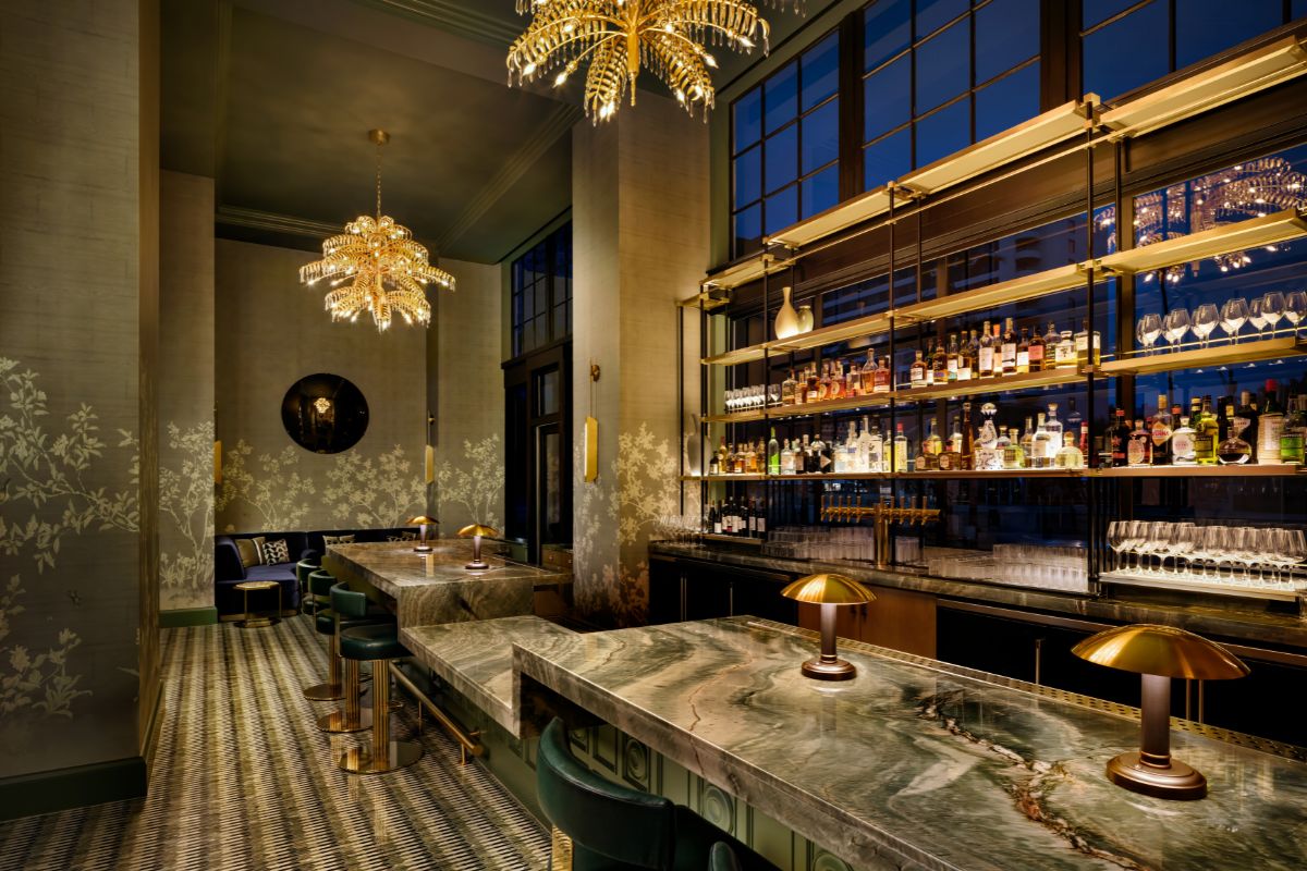 a bar with a marble counter and a bar with lights