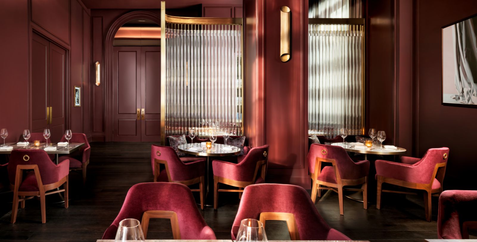 a restaurant with red chairs and tables
