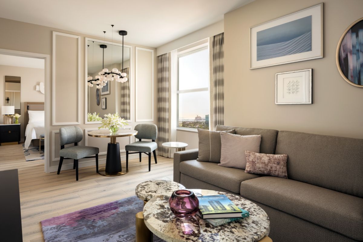 a living room with a couch and chairs
