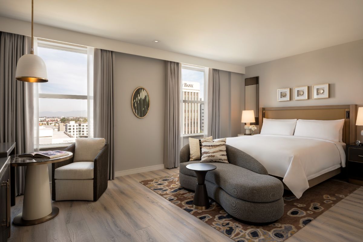a bedroom with a bed and a couch