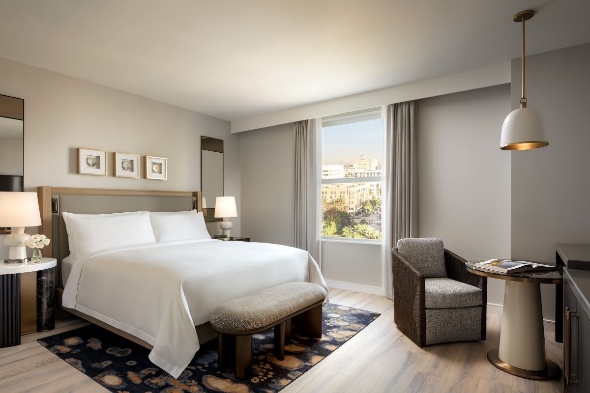 a bedroom with a bed and a chair