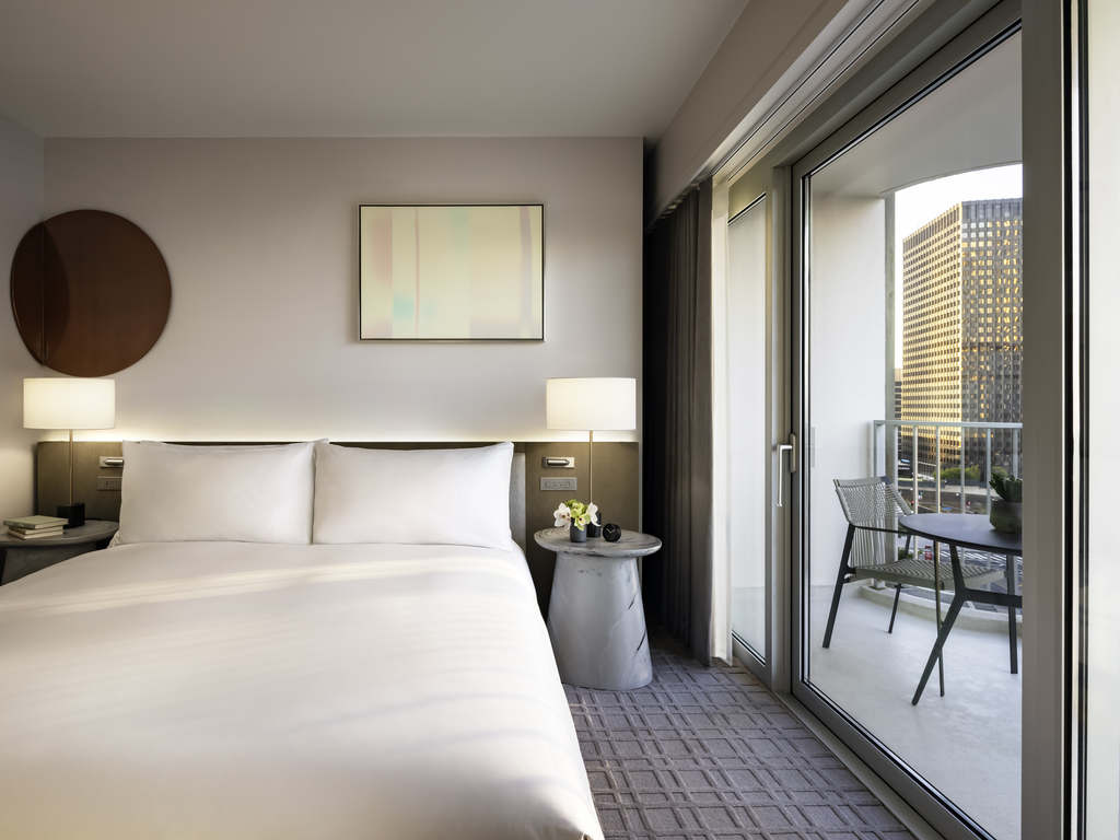 a bed with a glass door