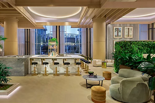 a room with a bar and chairs