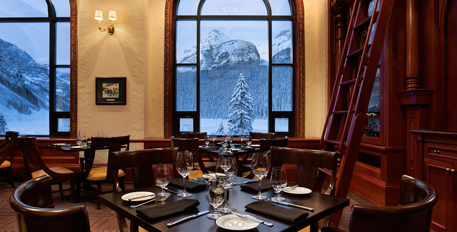 a restaurant with a view of snowy mountains