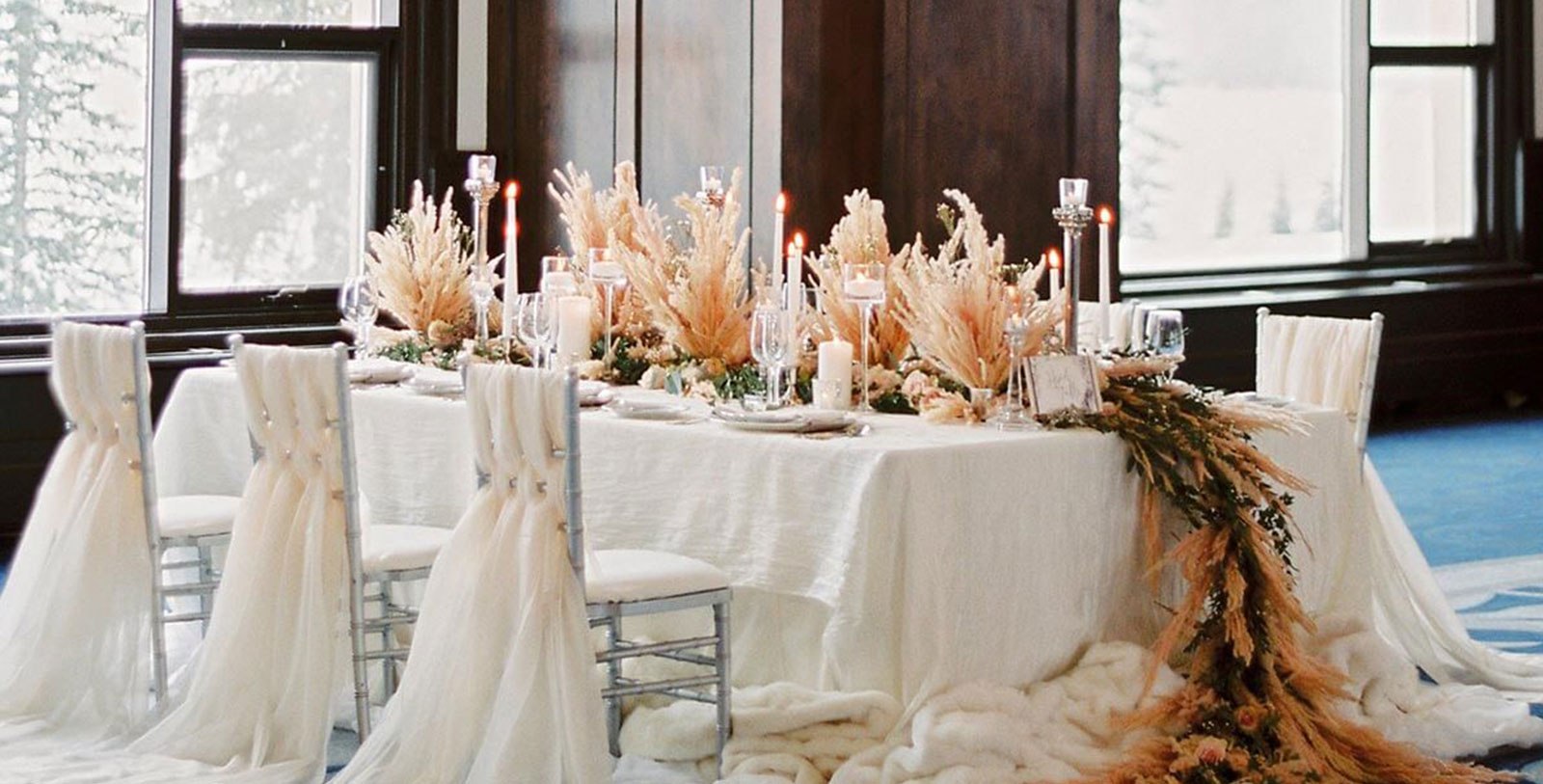 a table with candles and flowers