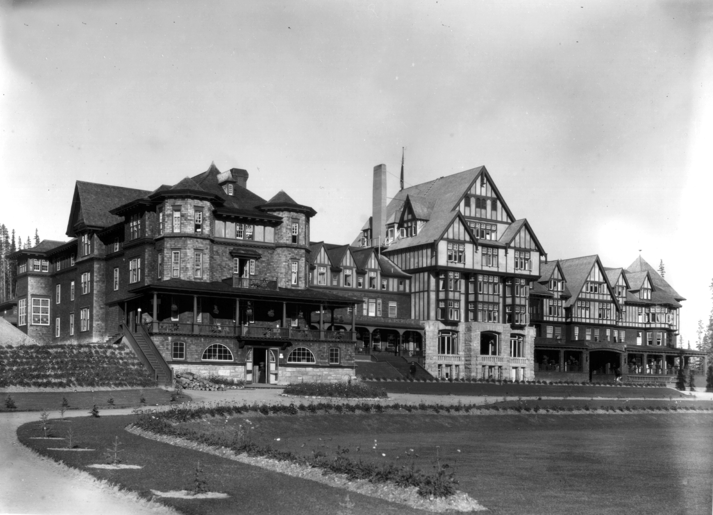 a large building with a lawn and grass