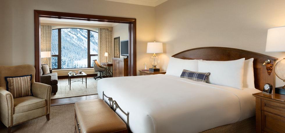 a bedroom with a bed and a television
