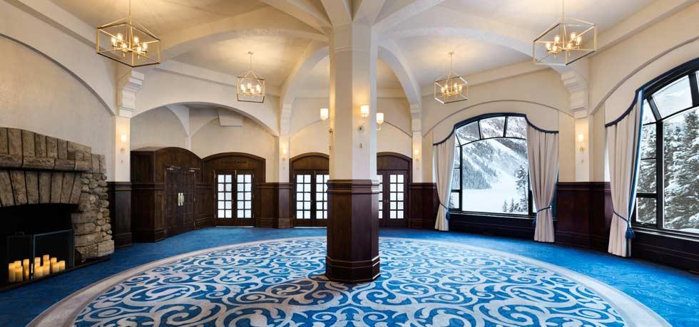 a room with a blue carpet and a window