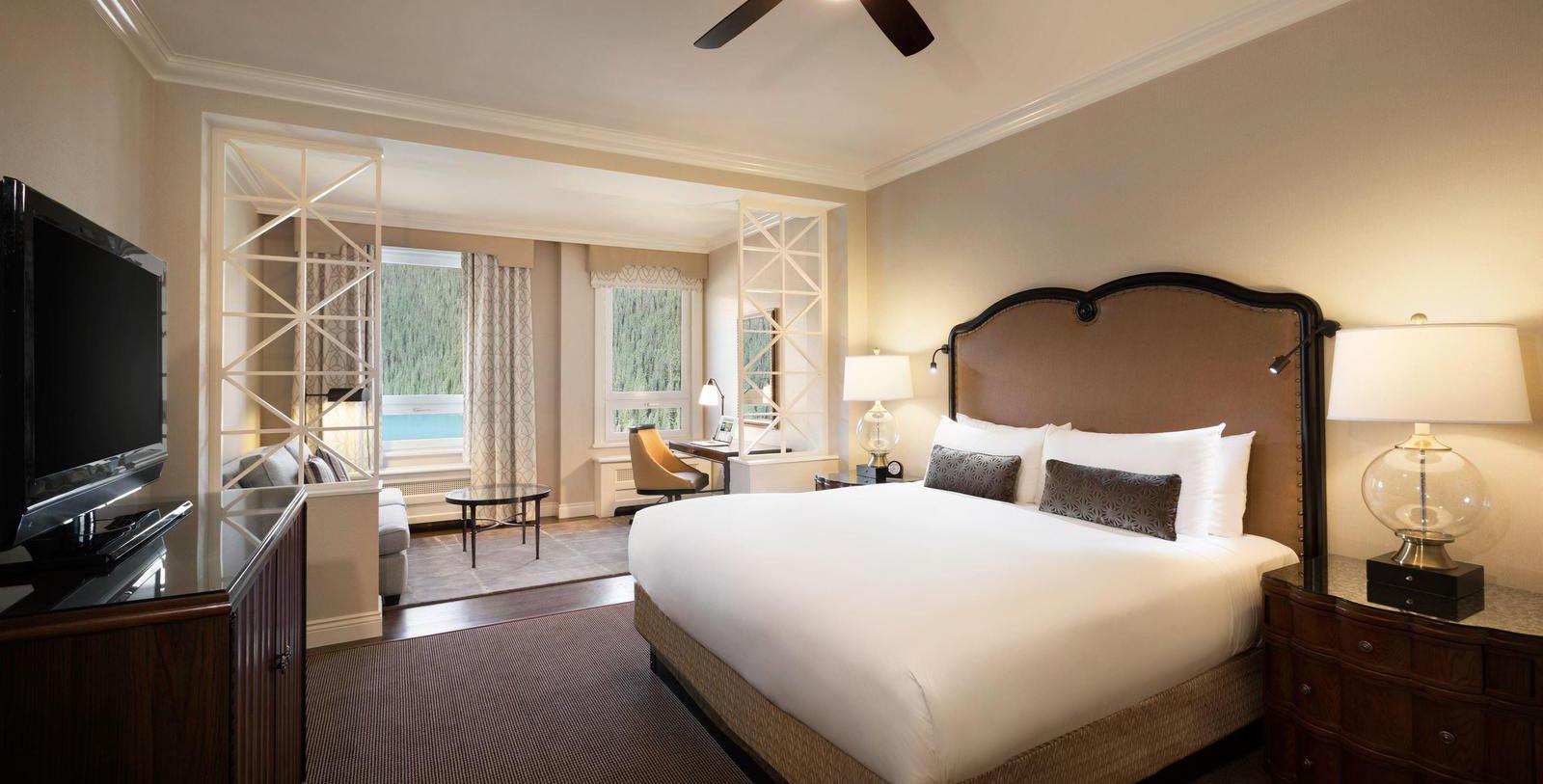 a room with a bed and a ceiling fan