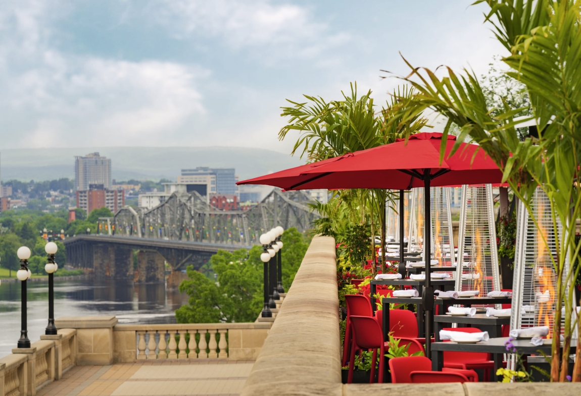 a restaurant with a bridge and trees