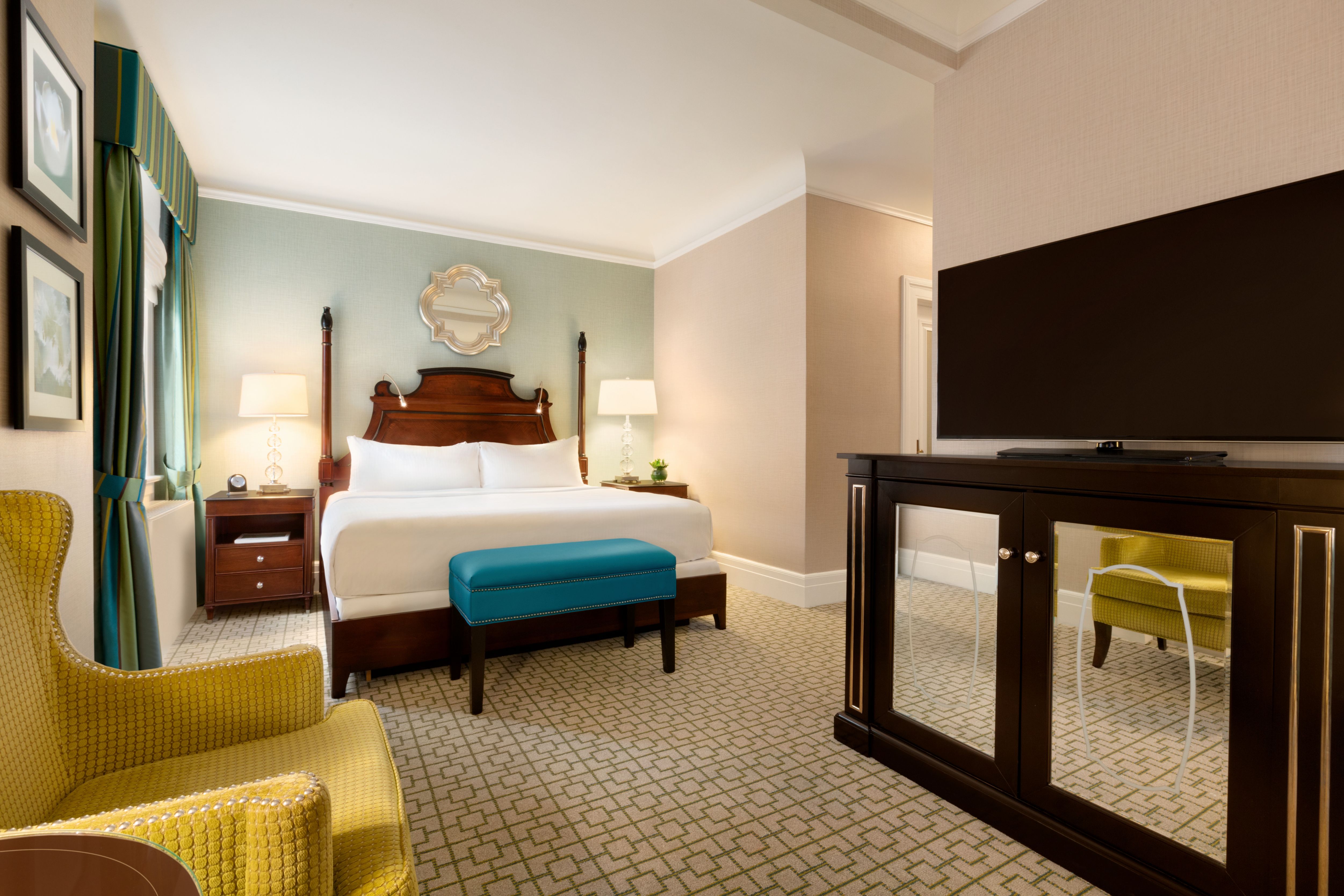 a room with a bed and a mirror