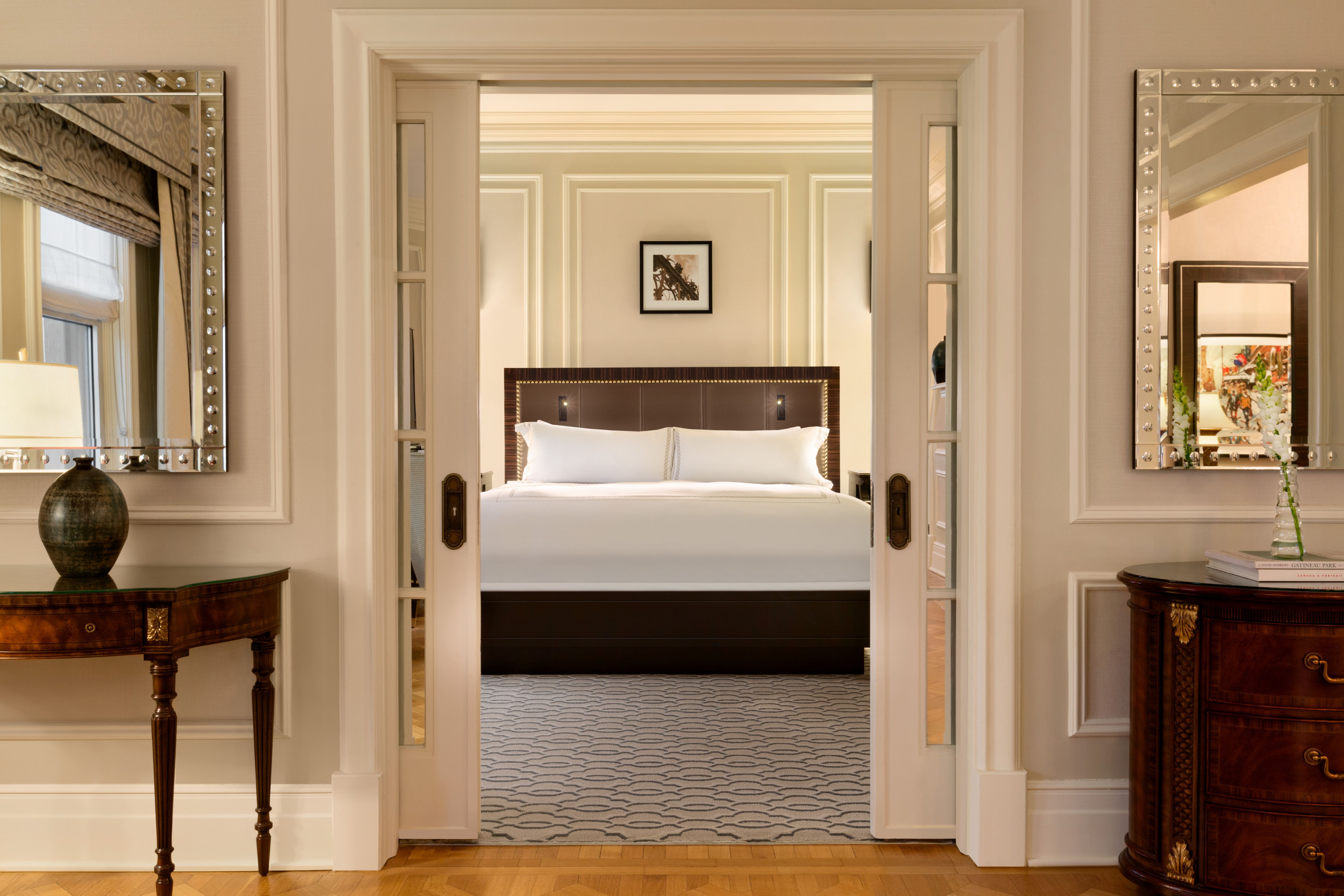a bedroom with a bed and a table