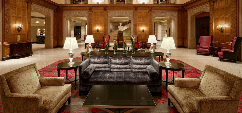 a room with a couch and chairs