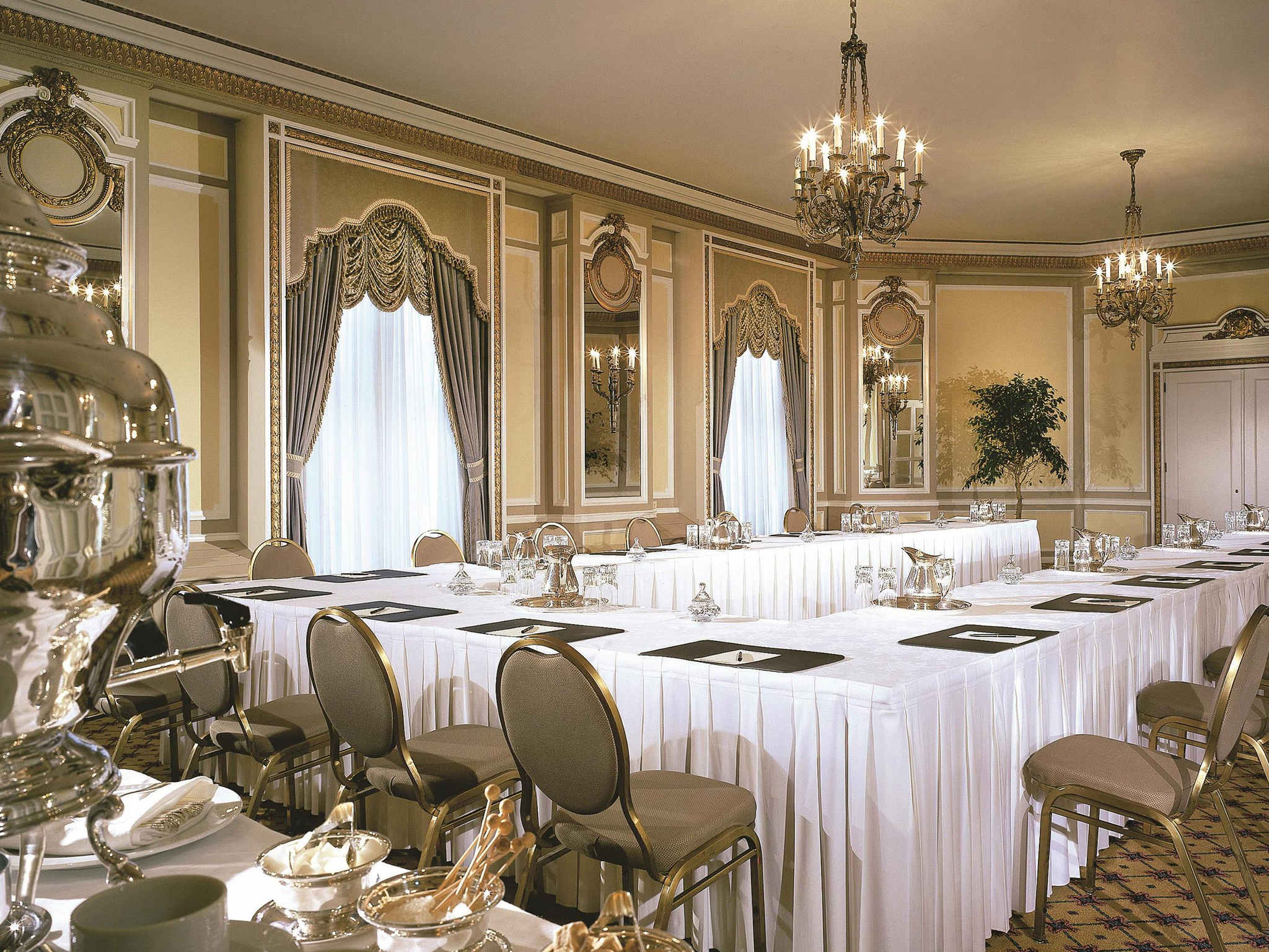 a long room with tables and chairs