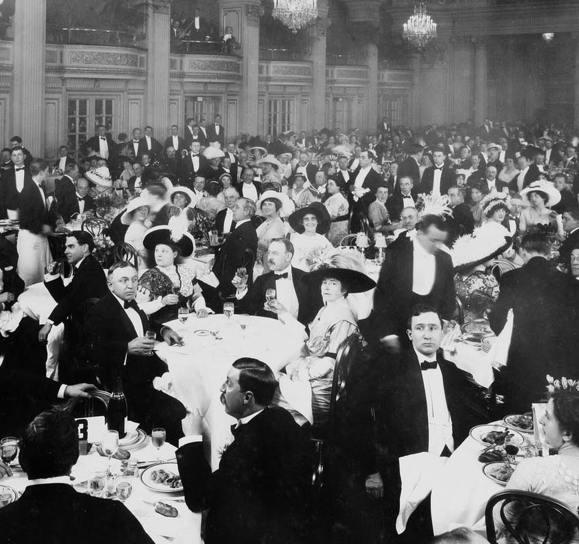 a group of people sitting at tables