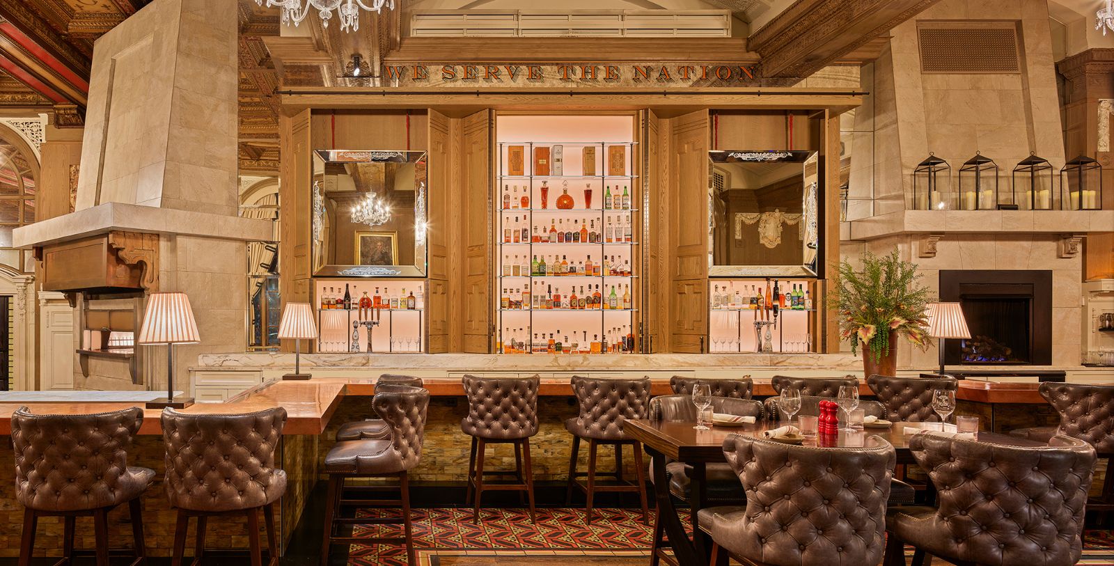 a bar with a counter and chairs