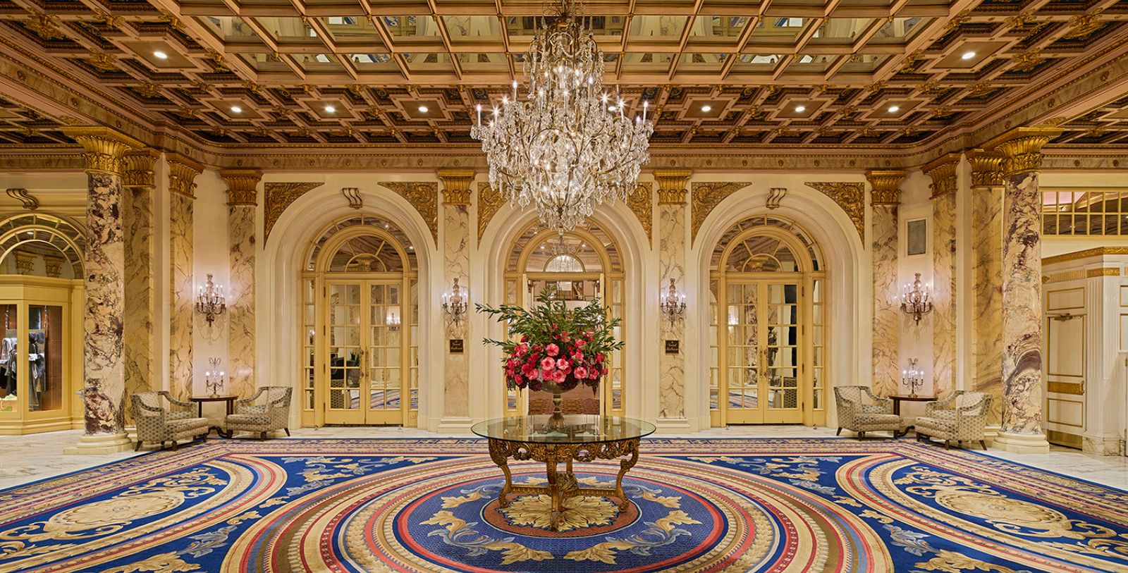 a large glass table with flowers in it