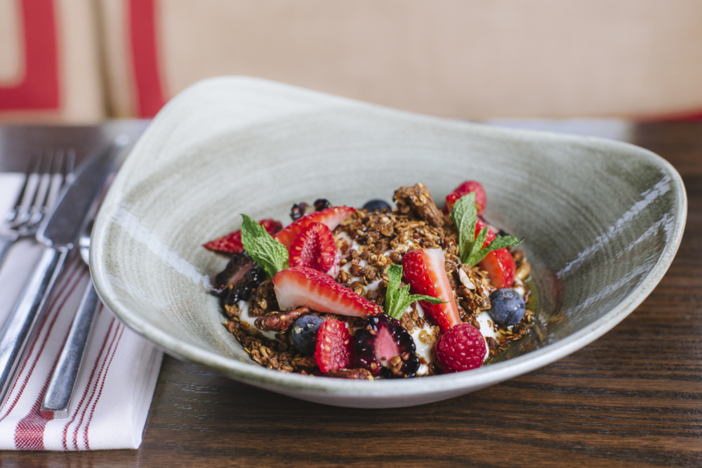 a bowl of cereal with berries and yogurt