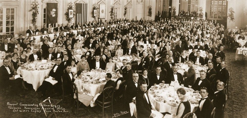 a large group of people sitting at tables