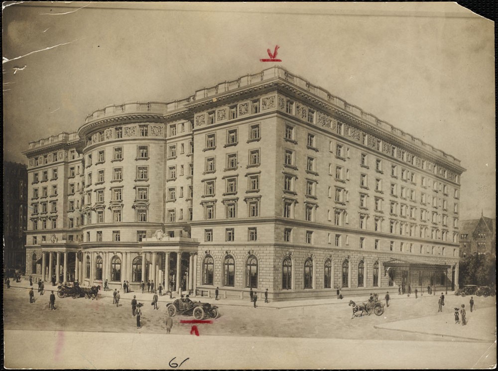a large building with people and cars