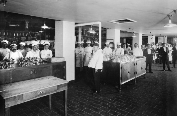 a group of chefs in a kitchen